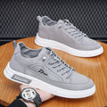 Men's grey canvas casual sneakers with round toe and low-top design featuring breathable ice silk fabric