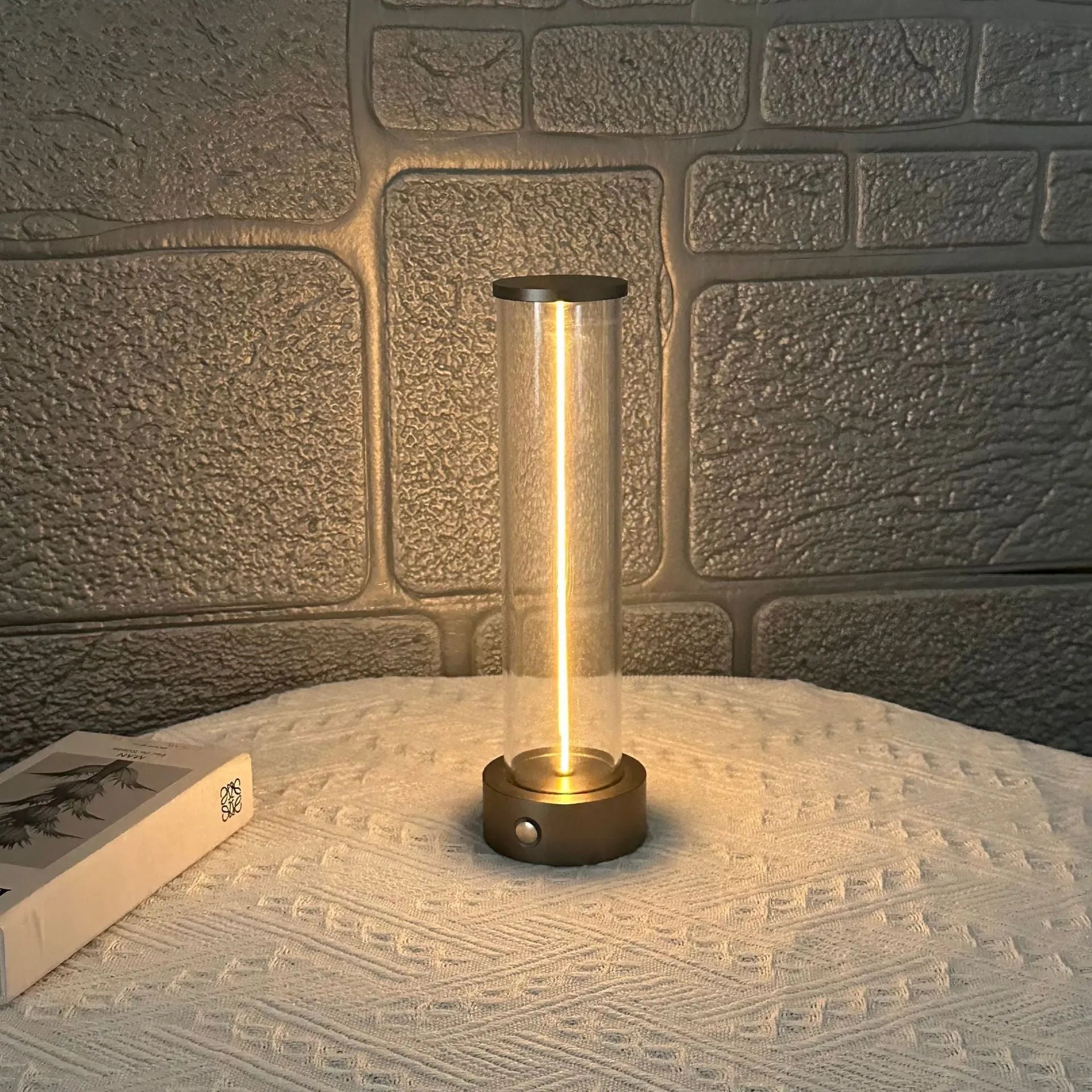 Modern glass USB LED night light with magnetic strip on a metal surface.