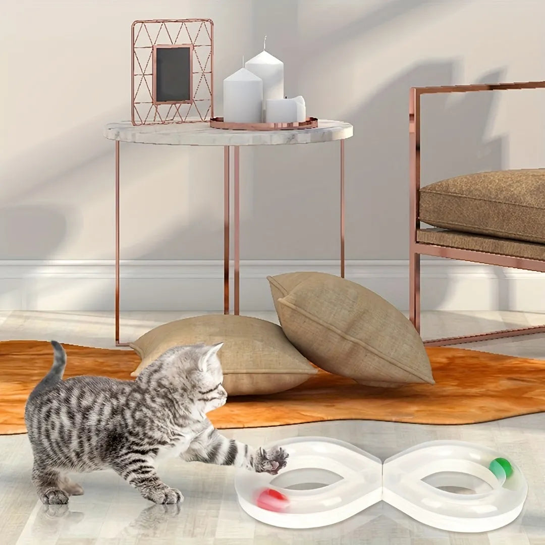 Cat toys set with rotating track ball turntable and teasing stick on white background