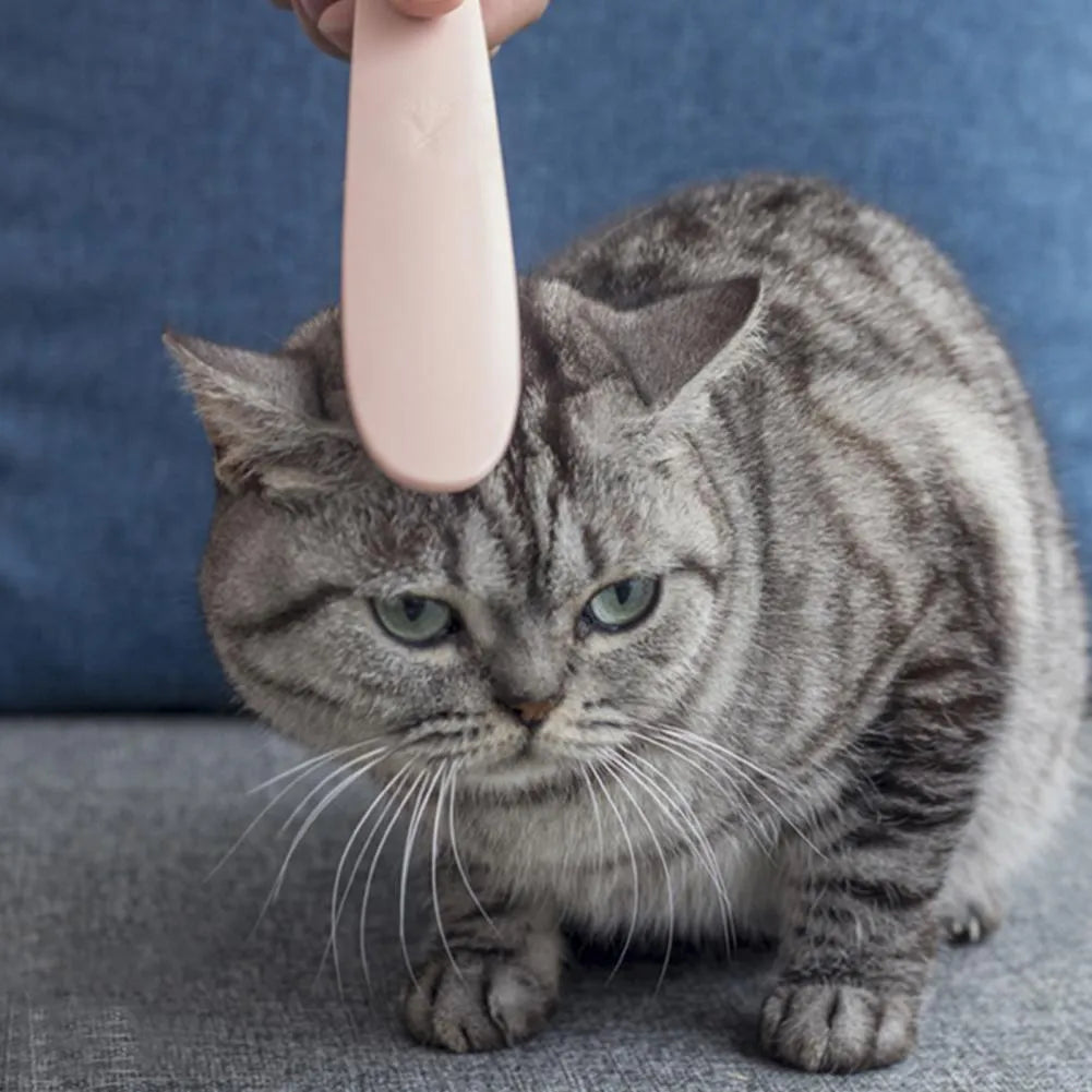 Grey cat grooming comb with tongue-shaped bristles and dual-width ends for gentle pet hair removal