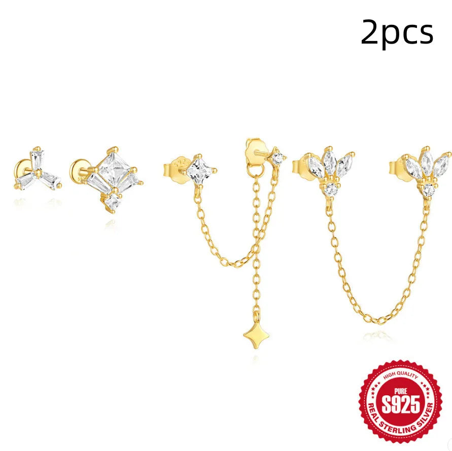 S925 sterling silver double ear piercing stud earrings with zircon stones in gold tone clover, crown, and chain horse eye designs.
