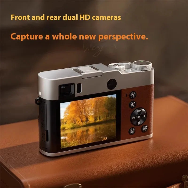 Black dual-lens digital camera with optical viewfinder and 2.88-inch screen on a strap.