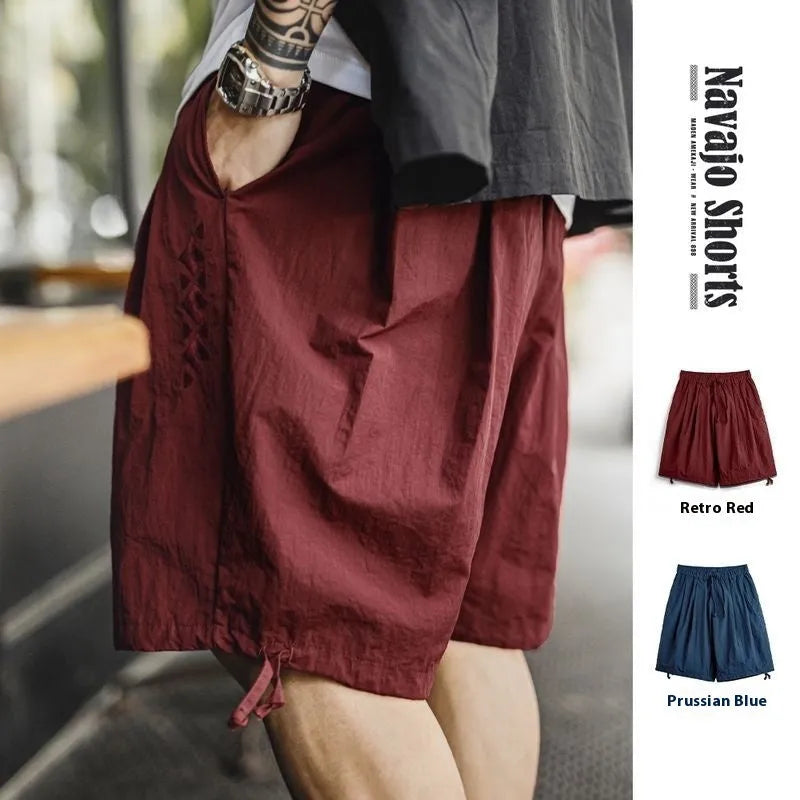 Men's Prussian blue embroidered beach shorts with loose fit and elastic waist