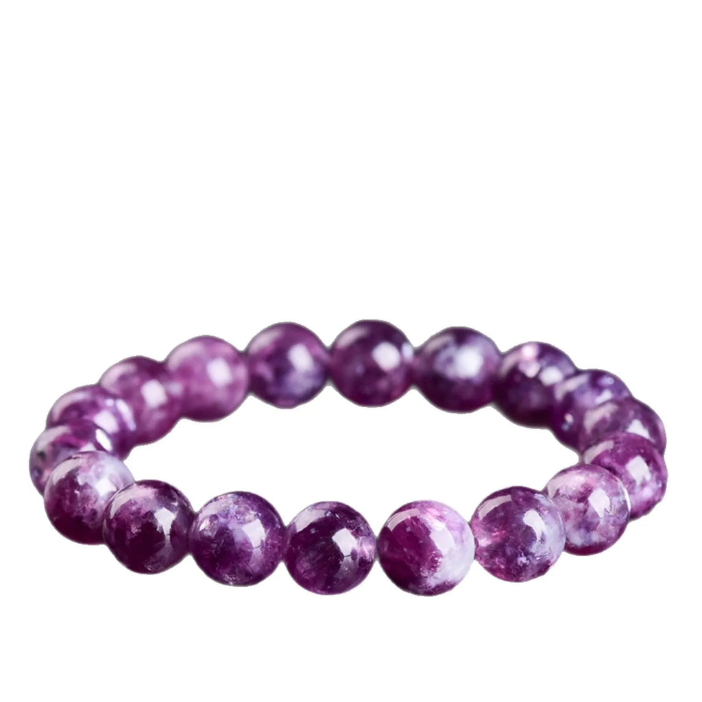 Grandmother crystal bracelet with polished geometric beads in purple on a wrist.