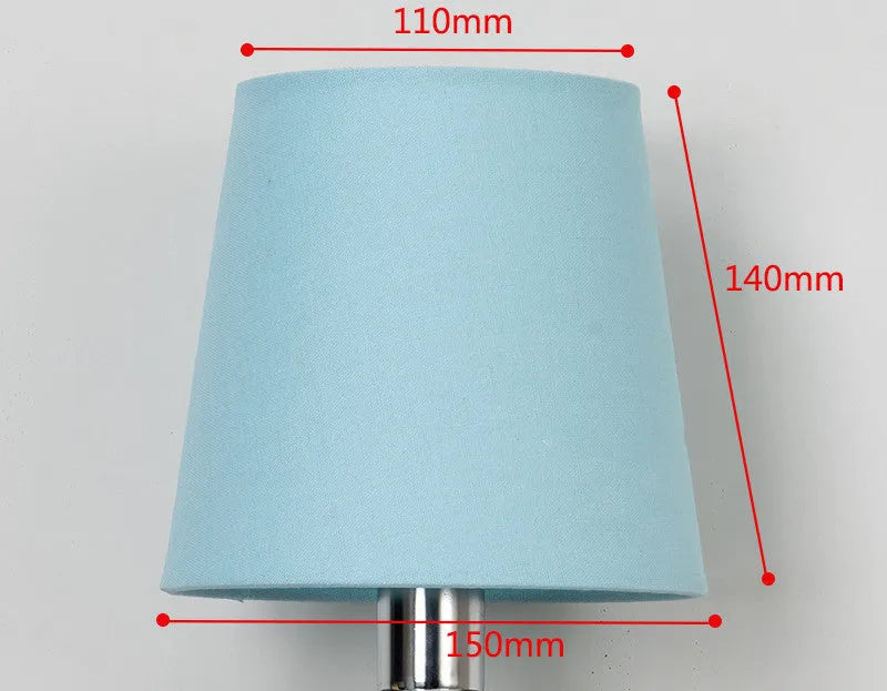 Modern minimalist fabric lampshade in a grey colour on a table lamp base.