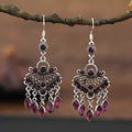 Purple retro drop earrings with long crystal fringe detailing and ethnic styling elements