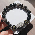 Men's silverstone bracelet with beadwork featuring Chinese proverbs, on a wrist.