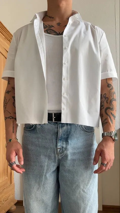 Men's white cropped short sleeve polyester shirt laid flat, showing plain design and regular fit.