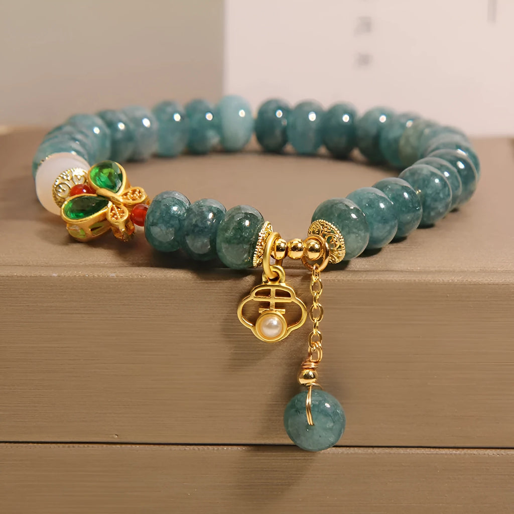 Blue jade abacus beads crystal bracelet with alloy inlay, rhinestone accents, butterfly charms and white agate beads
