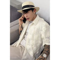 Loose fit short sleeve shirt with 3D floral pattern in milky white colour, shown on mannequin