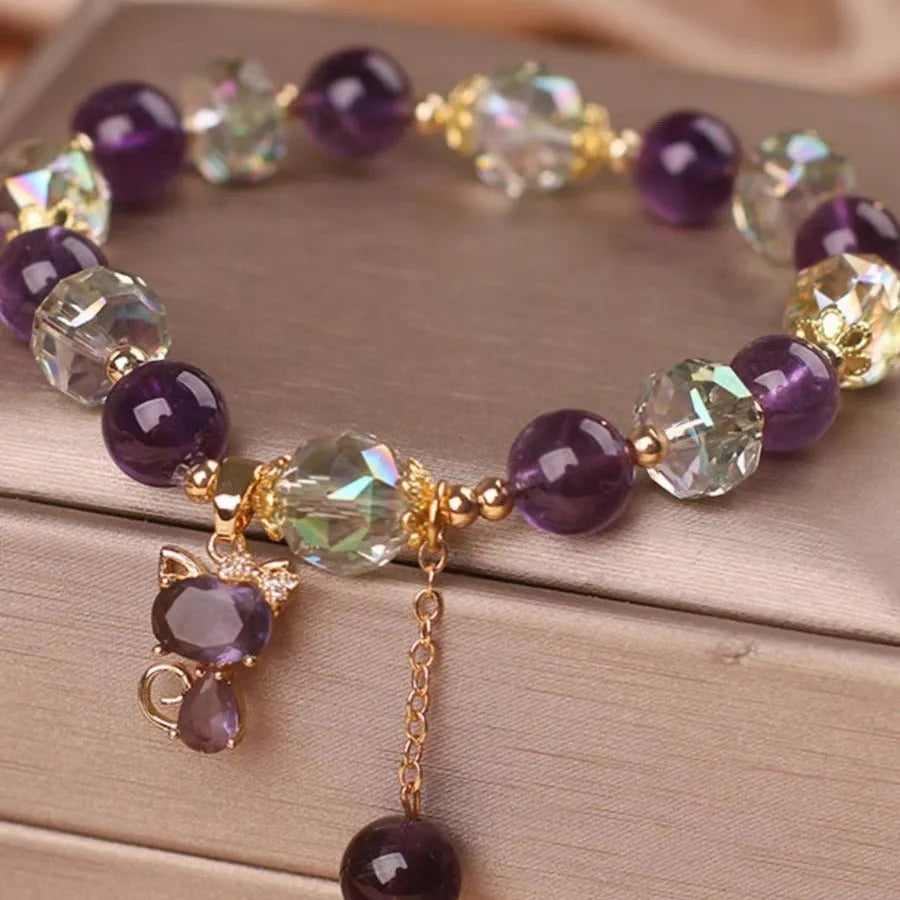 Women's antique-style crystal bracelet with a nine-tailed fox pendant and a separate amethyst floral charm.