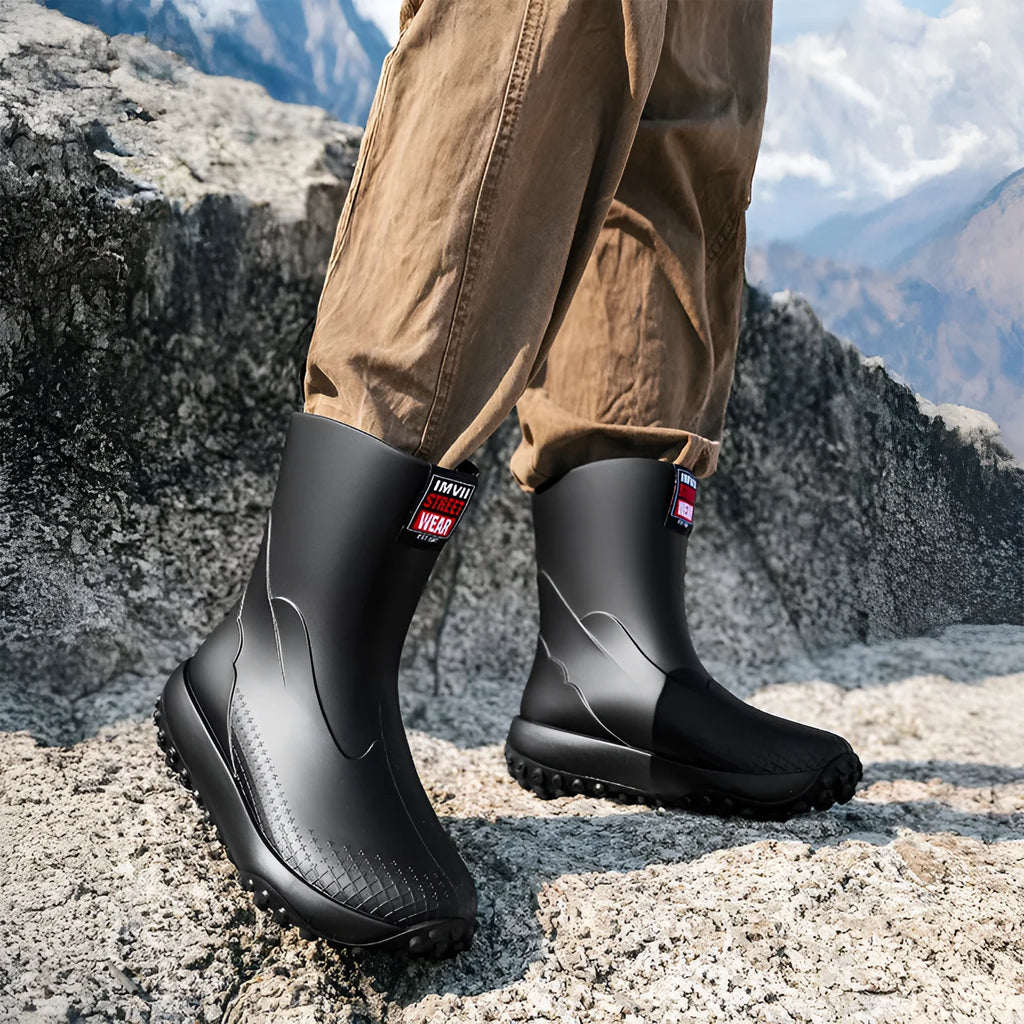 Men's mid-height PVC rain boot in beige colour with a round toe and plastic sole.