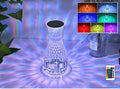 Vase-shaped crystal table lamp with diamond-like LED lighting on wooden surface