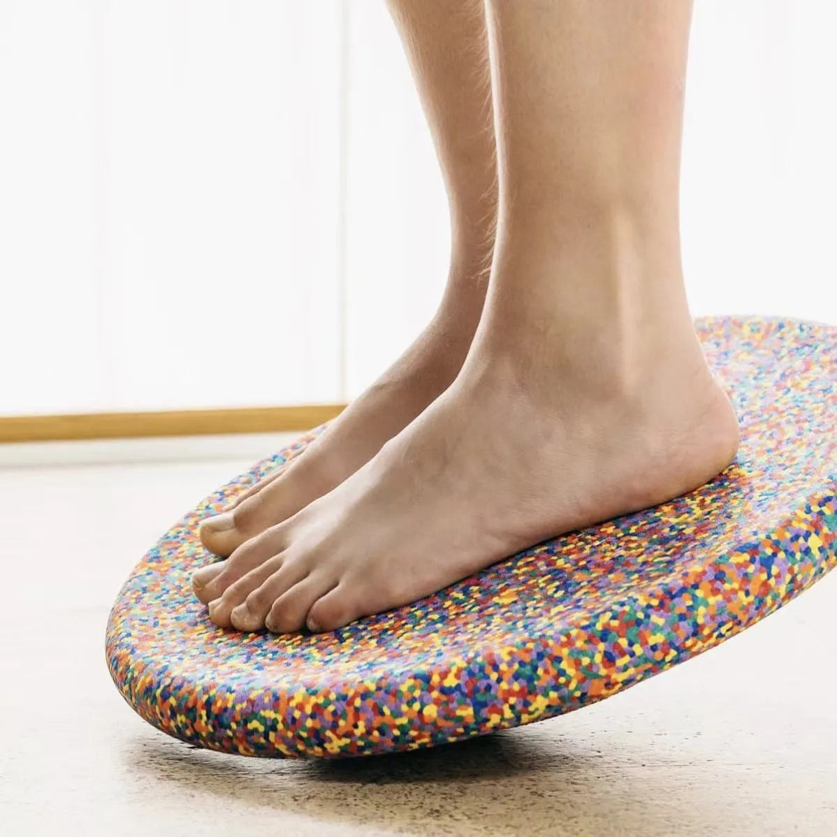 Plastic wood-grain surf balance board for a child aged 4-6 years.