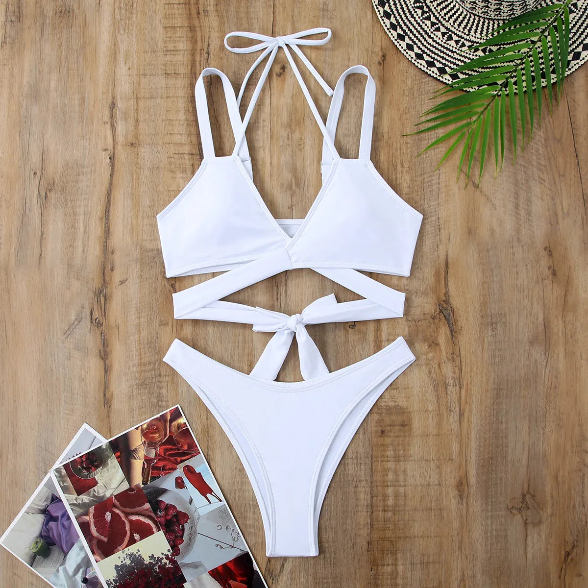 A solid colour women's strap bikini swimsuit on a white background.