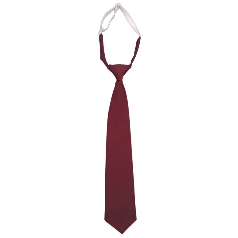 A navy blue cotton men's bow tie with an arrow style design on a white background.