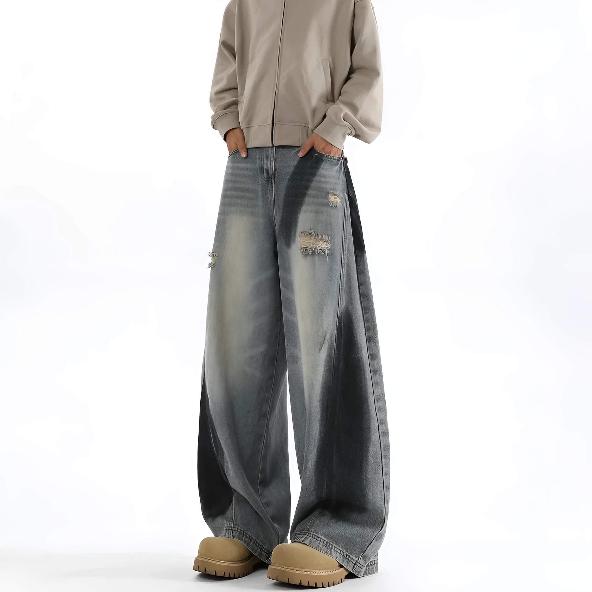 Men's blue ripped jeans with splash-ink design detail showing cotton fabric with micro elasticity