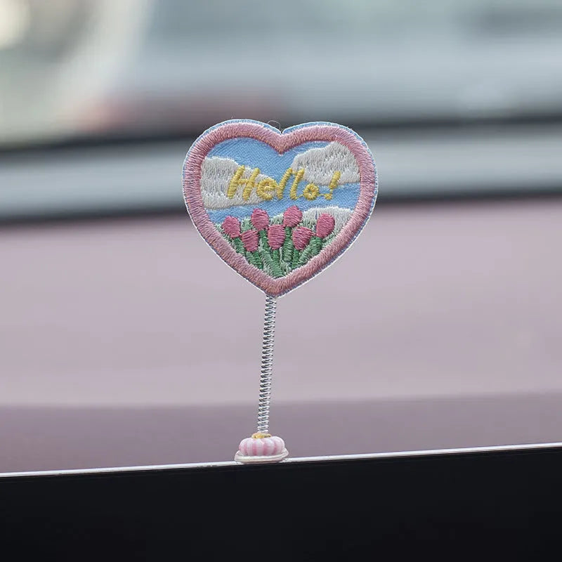 Set of six small PVC cartoon duckling car decorations with hello sign on car dashboard