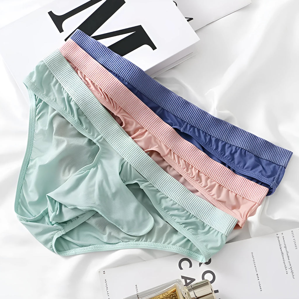 Men's black low-waist Ice Silk briefs underwear on a plain background