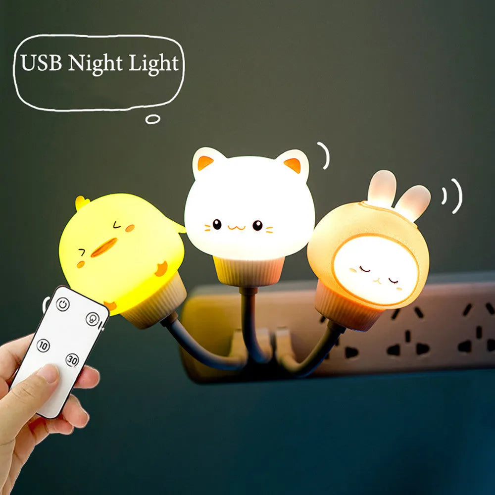 Cute cartoon animal USB night light in bear shape with remote control on a bedside table.