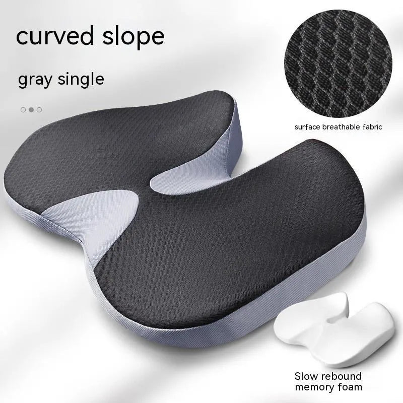 Curved wedge seat cushion for tailbone support in car, shown in beige colour with memory foam interior