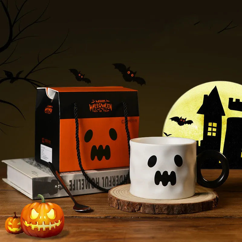 Orange and white Halloween pumpkin-shaped ceramic mug with handle on a table.