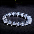 Women's original white crystal pyramid bracelet with ruyi charm, showing polished beads.