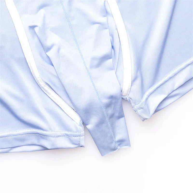 A pair of solid grey men's ice silk boxers laid flat, showing the mid-waist design.