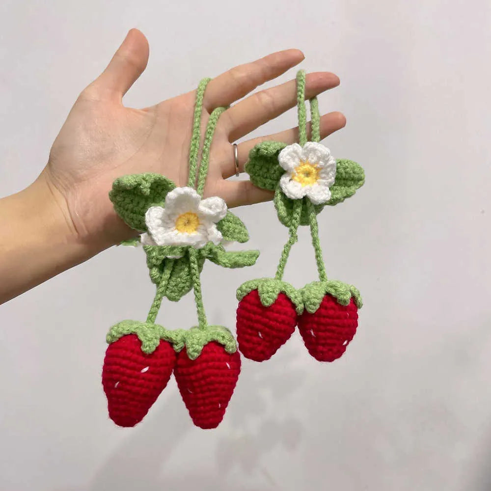 Handmade strawberry-shaped weaving pendant made of cotton and hemp wool for car decoration.