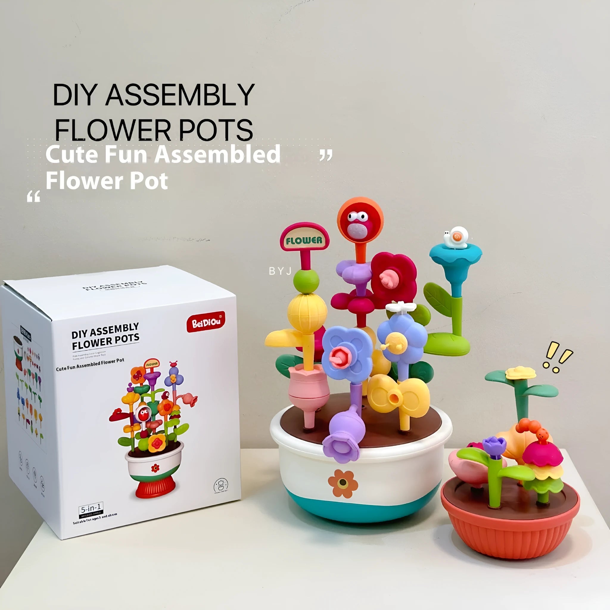 Colourful plastic flowerpot building block set with assorted flower-shaped pieces, in a colour box