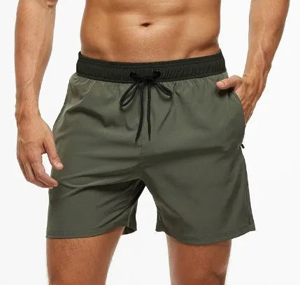 Men's blue fitness shorts with a drawstring waistband and a side zipper pocket.