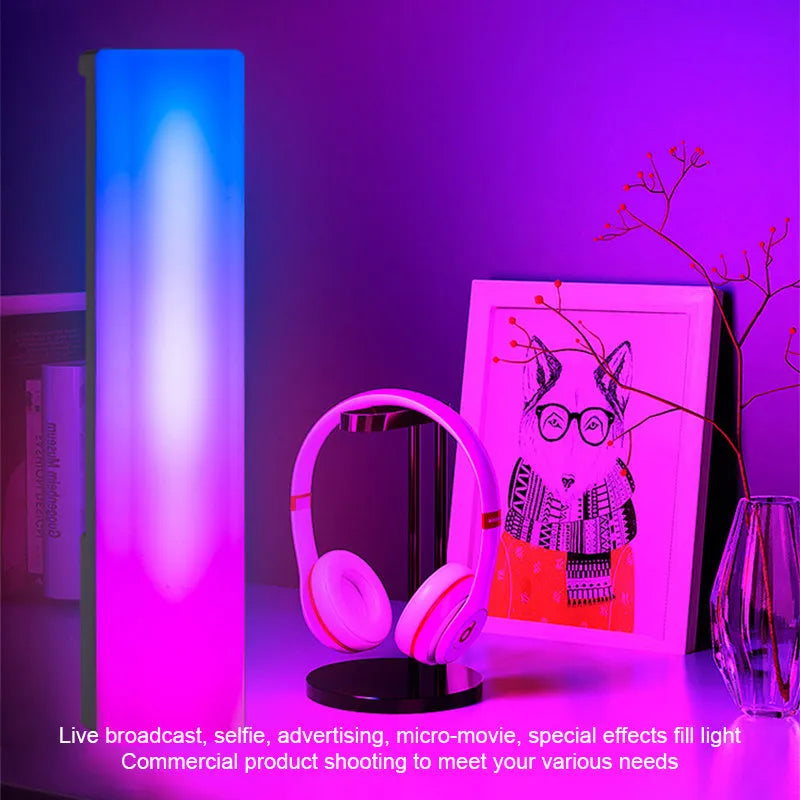 3D RGB music rhythm table lamp with voice control in black or white shell on a desk.