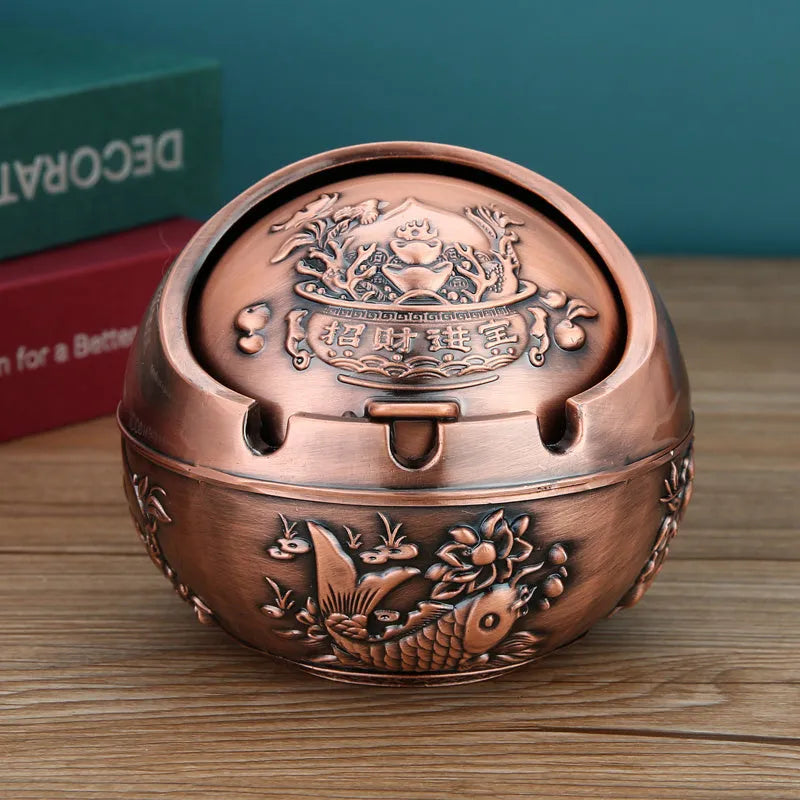 Bronze alloy ashtray with decorative fortune tree design and smoke extinguishing slot.