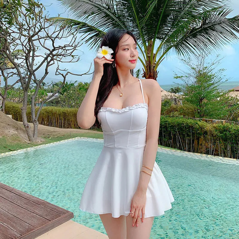 White women's one-piece swimsuit with hollow out detailing, nylon fabric, sizes M L XL