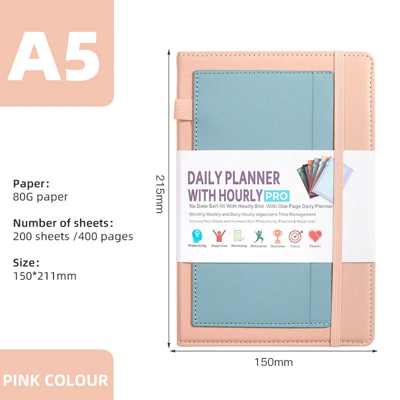 A5 notebook with PU leather cover in matcha green, lying open on a desk