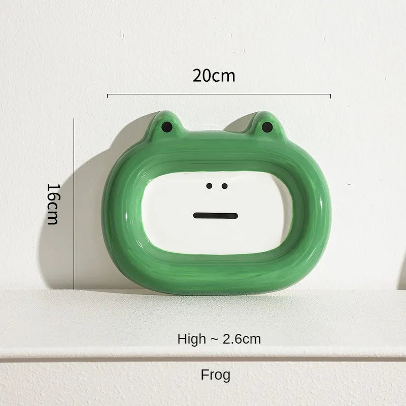 Glazed ceramic pet food bowl with animal design and non-slip rubber base ring.
