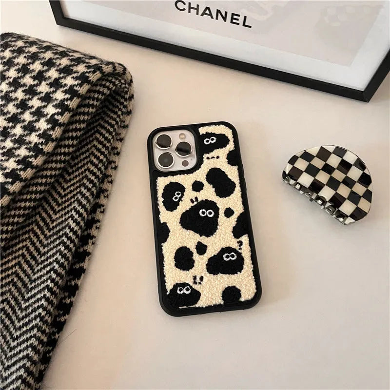 Black plush phone case with a Fairy design for iPhone models