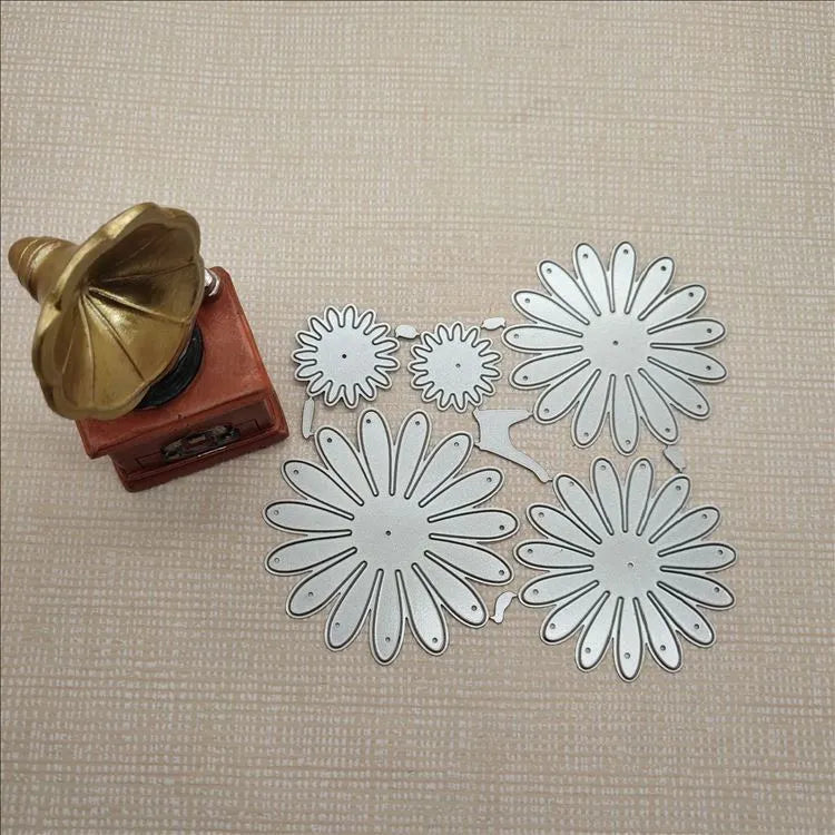 Silver high carbon steel flower combination cutting die mould measuring 12.5 by 13 cm