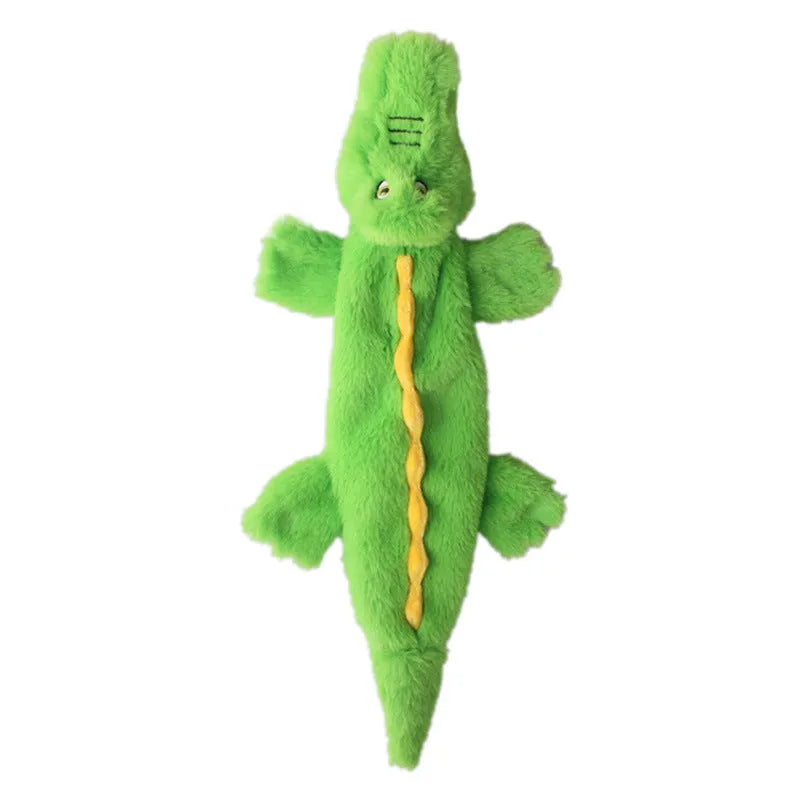 Green crocodile-shaped plush dog toy with a squeaker in the head and crinkle paper in the tail.