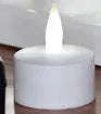 White plastic USB rechargeable LED candle lamp showing yellow glowing flame.