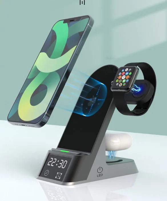 Black six-in-one wireless charging alarm clock with colour display on a nightstand.