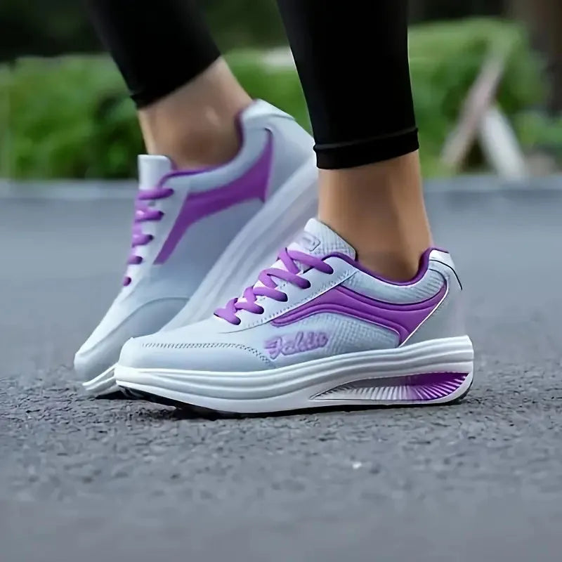 Women's low-heel sports shoe in a selection of colours including grey powder and yellow.