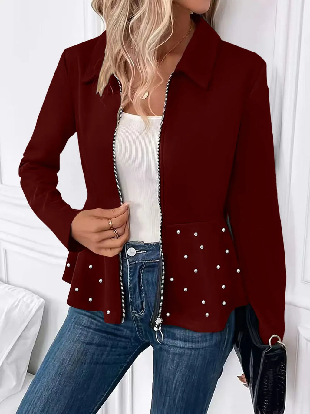 Women's black loose fit coat with beaded front zipper and ruffle hem detail, long sleeves