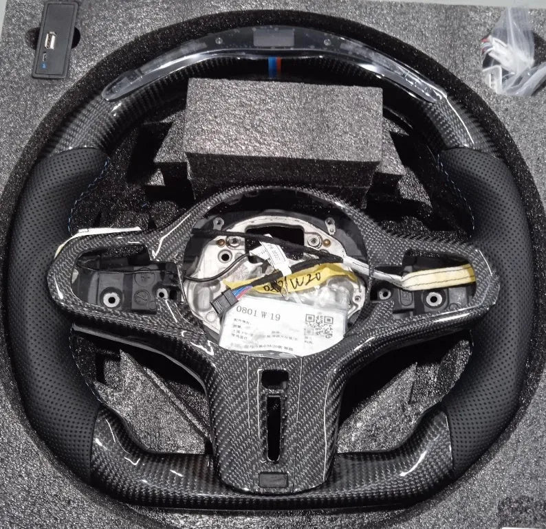 Black carbon fibre steering wheel for BMW with LED display and multifunction buttons