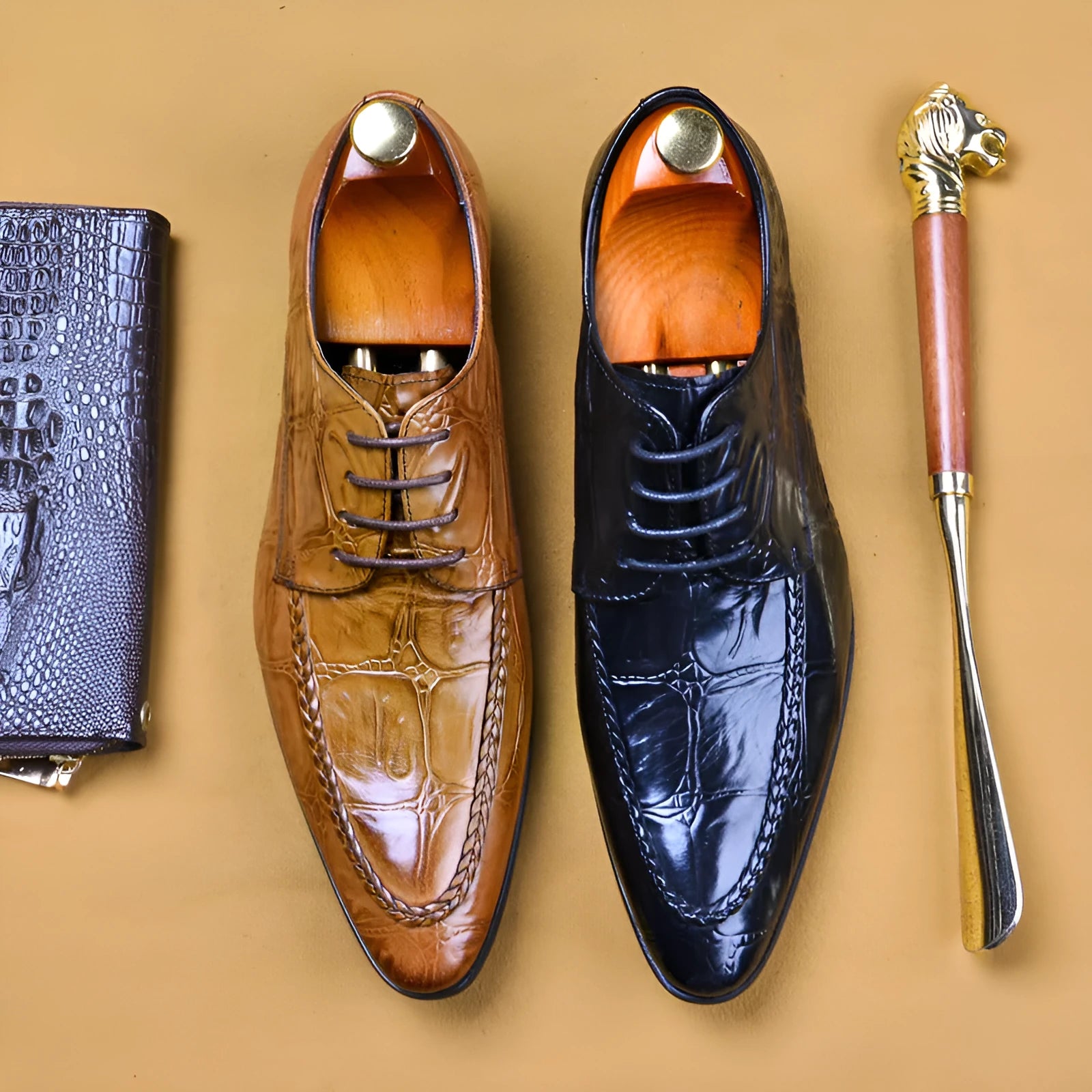 Men's brown leather loafers with a shiny horsebit buckle detail on the front, shown on a foot.