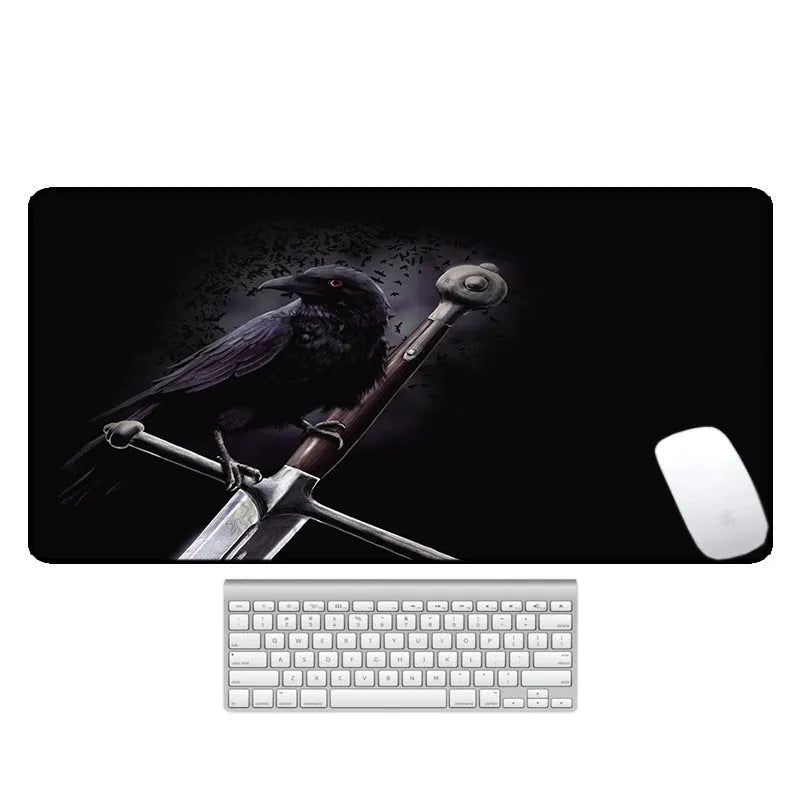Large printed desk mouse pad with natural rubber non-slip base, shown on a wooden desk.