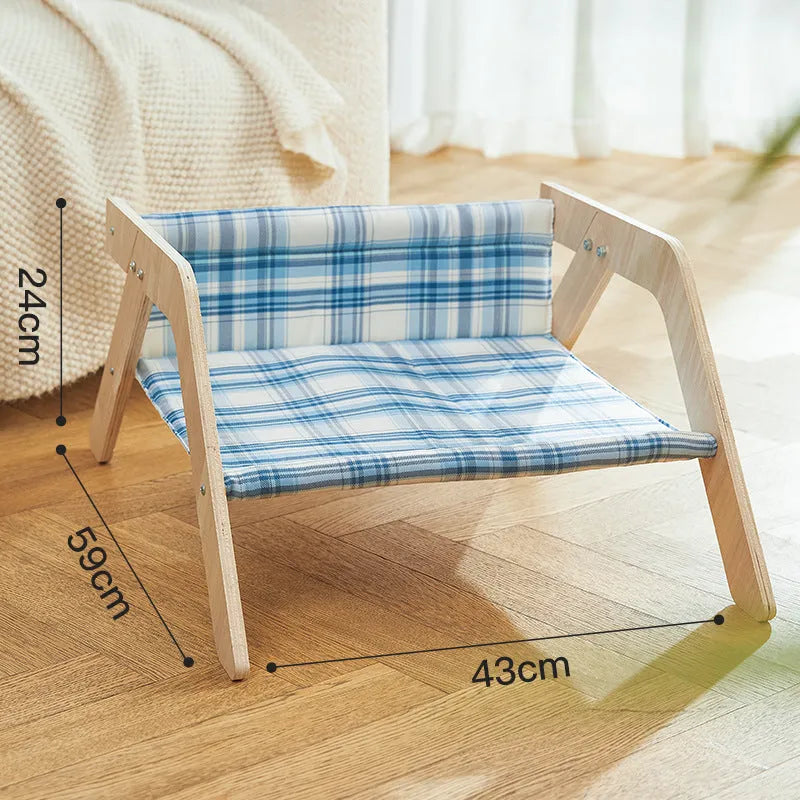 Wooden cat beach chair bed with blue cloth hammock suspended from frame