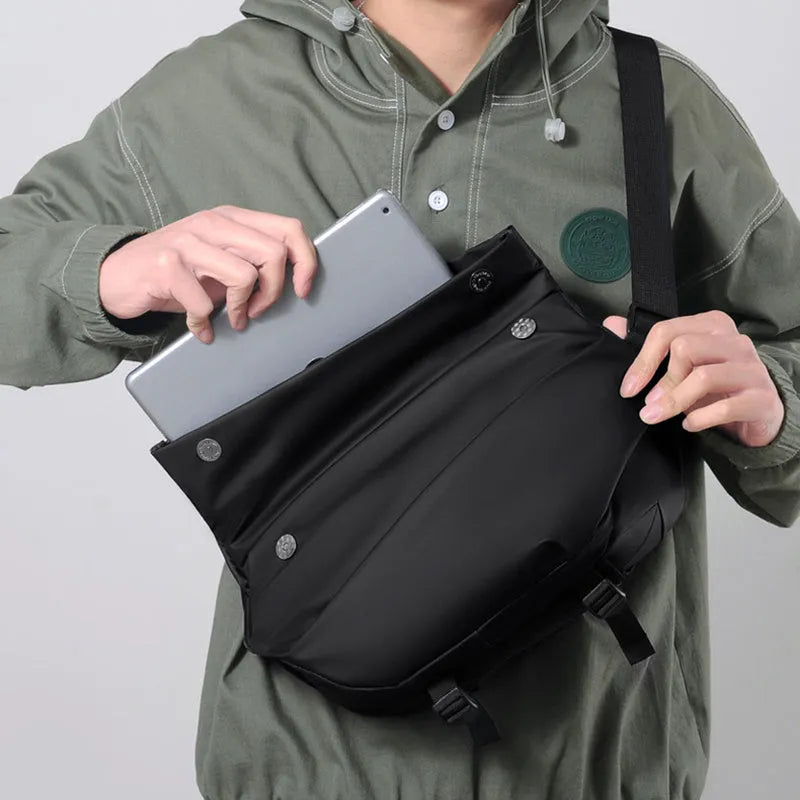 Grey PU leather men's crossbody sling backpack showing front zipper and shoulder strap.