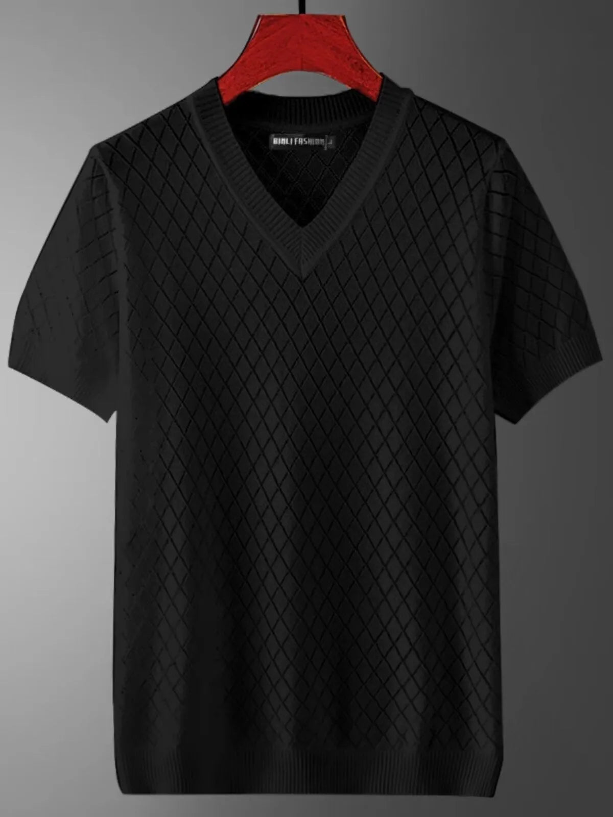 Man wearing a black Korean-style ice silk V-neck t-shirt, showcasing the cut-out detail and casual fit.