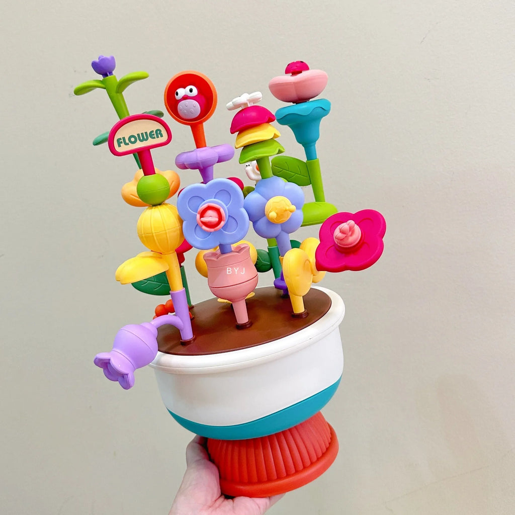 Colourful plastic flowerpot building block set with assorted flower-shaped pieces, in a colour box
